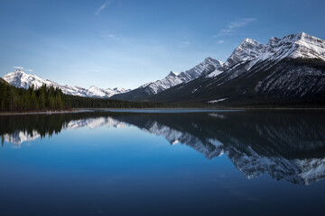Reflection of the Canadian Rocky Mountains in the still water of the Goat Lake in Kananaskis Provincial Park