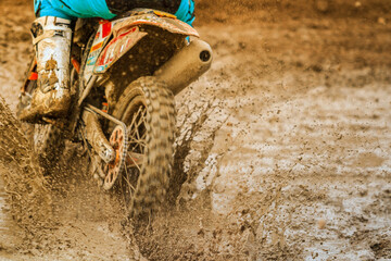 Flying debris during an acceleration in motocross race