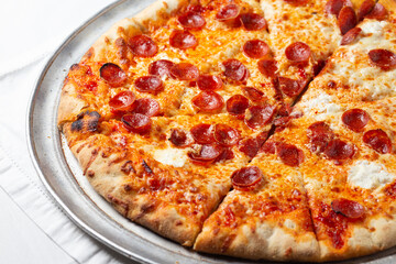 Mini pepperoni pizza on a white background. Fast food restaurant
