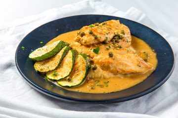 Italian chicken-zucchini skillet. Piccata. Delicious creamy meat with mashed potatoes and green peas 