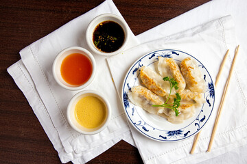 Japanese gyoza.fried gyoza dumplings with sauces. Top view, flat lay