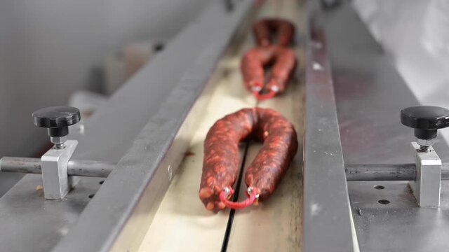 Sausages. Packing line of sausages. Industrial manufacture of sausage products. High quality 4k footage