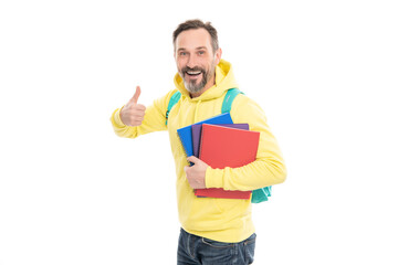 happy man carry backpack hold notepad or workbook for education isolated on white, thumb up.