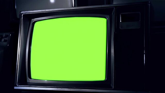 Old TV Set Turning Off Green Screen. Close Up. Zoom Out. You can replace green screen with the footage or picture you want. You can do it with “Keying” effect in After Effects. 4K Resolution. 
