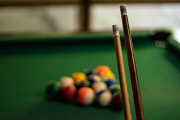 Billiard cues and balls