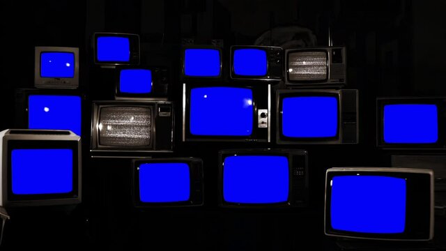 Stacks of Retro TVs Turning On and Off Blue Chroma Screens. You can replace blue screen with the footage or picture you want. You can do it with “Keying” effect in After Effects. 4K Resolution.