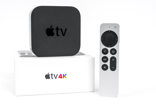 May 29, Rostov, Russia: New unpacked Apple TV 4K console with box and Siri Remote control with a touch-enabled clickpad on a white background, front view, copy space.