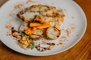 Chicken parmigiana. Traditional Italian comfort dish. Chicken breast covered in breadcrumbs fried, topped with marinara sauce, melted mozzarella, parmigiana and provolone cheeses and Italian parsley.