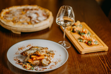 Chicken parmigiana. Traditional Italian comfort dish. Chicken breast covered in breadcrumbs fried,...