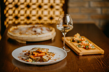 Chicken parmigiana. Traditional Italian comfort dish. Chicken breast covered in breadcrumbs fried, topped with marinara sauce, melted mozzarella, parmigiana and provolone cheeses and Italian parsley.
