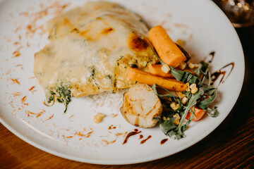 Chicken parmigiana. Traditional Italian comfort dish. Chicken breast covered in breadcrumbs fried, topped with marinara sauce, melted mozzarella, parmigiana and provolone cheeses and Italian parsley.