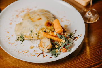 Chicken parmigiana. Traditional Italian comfort dish. Chicken breast covered in breadcrumbs fried, topped with marinara sauce, melted mozzarella, parmigiana and provolone cheeses and Italian parsley.