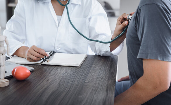 Female Physician Doctor Consulting and Advice Health Checkup for Her Petient in Examination Room, Medical Doctor Consultation and Guidance Illness Diagnose Disease Patient at Clinic Hospital.