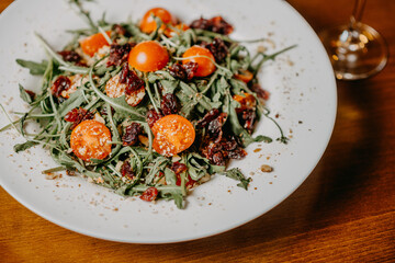 Fresh salad with cucumber  tomato arugula corn and sesame dressing