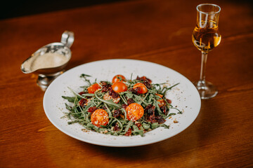 Fresh salad with cucumber  tomato arugula corn and sesame dressing