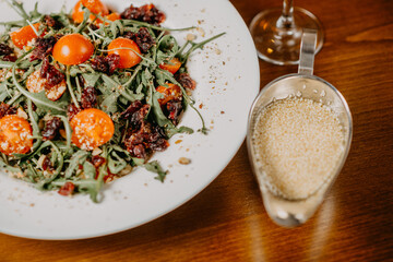 Fresh salad with cucumber  tomato arugula corn and sesame dressing