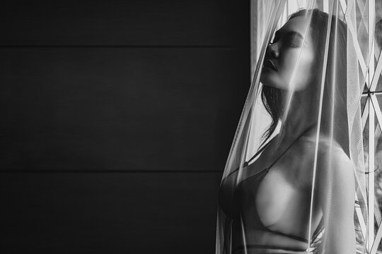 dramatic nude art of Asian naked sexy female model in lingerie