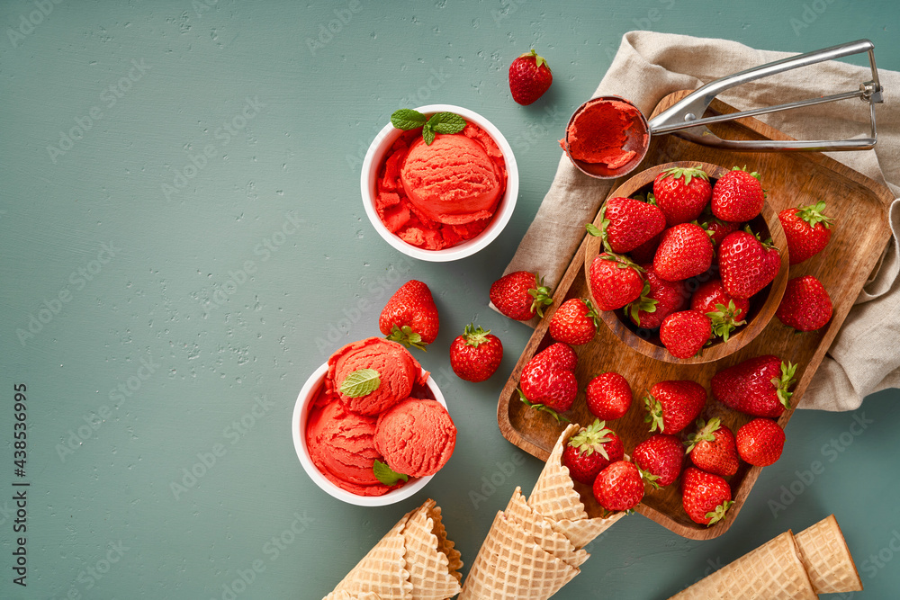 Aufkleber strawberry sorbet with strawberries on blue background with copy space. heap of strawberry with ice 
