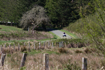 ATV rider on rural gravel road