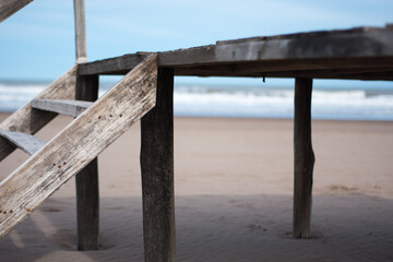 Old wooden structure with parador type staircase on a deserted beach