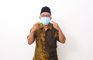 Portrait asian man standing while using a face mask. Isolated on white background