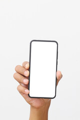 Man's hand holding the black smartphone with blank screen and modern frameless design. Isolated on white background.