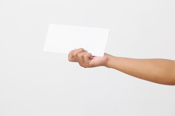 Man's hand holding envelope isolated on white background. Close up