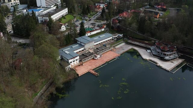 Ursu Lake and Lacul Ursu hotel, Sovata in Romania. Aerial top-down ascendent