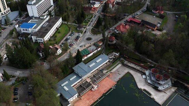 Lacul Ursu and Sovata hotel on shore, Romania. Aerial top-down reverse