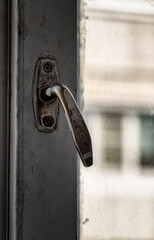 Closed a large white wooden old window close-up.