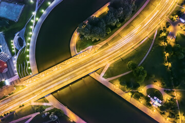 aerial night view of the bridge. night car traffic with light trails. drone photo.