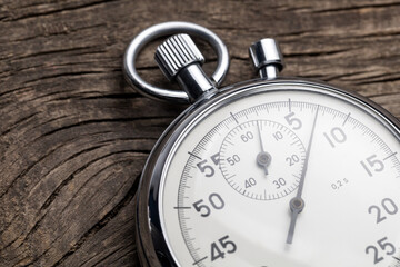 Stopwatch on old wooden background