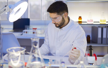 Scientist preparing research paper article for modern medical journal. Portrait of serious man in...