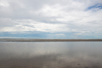 Beach view during the day with cloudy weather