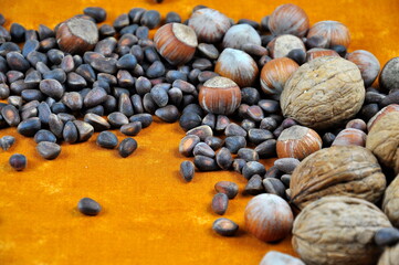 A composition of different nuts on the table. Background image.
