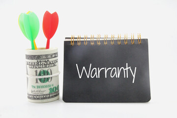 arrows, a roll of paper money, a notebook and the word warrantty