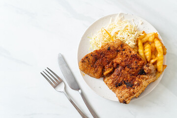 grilled spicy barbecue pork steak with french fries