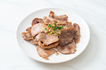 grilled pork neck sliced on plate