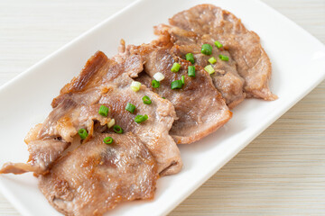 grilled pork neck sliced on plate