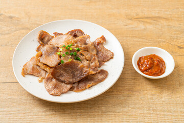 grilled pork neck sliced on plate
