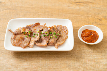 grilled pork neck sliced on plate