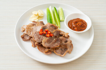 grilled pork neck sliced on plate