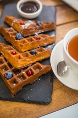 waffles on a plate with chocolate sauce. High quality photo