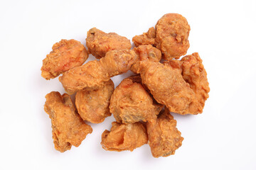 Light battered deep fried chicken variety mix pieces pile on white background healthy fry