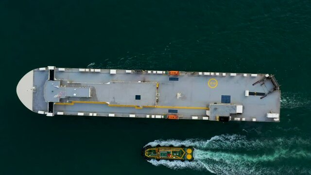 Aerial View Of Large Roro Vehicle Carrier Vessel Sailing On The Green Sea 4k video 