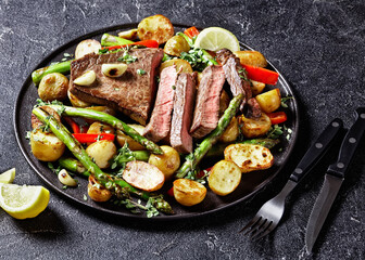 beef steak with veggies on a plate