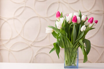 bouquet of delicate tulips on a light background.
