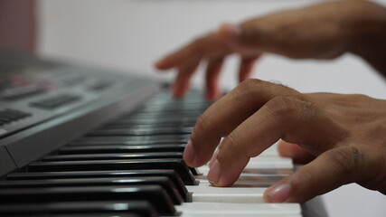 Fototapeta na wymiar Man hand playing electronic piano