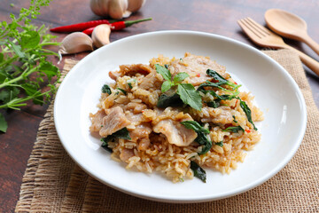 Stir fried Thai basil with pork fried rice at close up view with ingredients - Thai food called Khao Klook Ka Prao moo