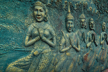 Elaborate wall decoration showing Buddhism Virtues in Sampov Pram Pagoda atop Preah Monivong National Park in Kampot, Cambodia